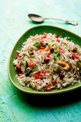 Dapde Pohe is a typical Maharashtrian breakfast, made with thin variety of poha and fresh coconut with chilli, peanuts and nuts. served in a bowl or plate. selective focus