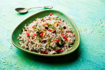 Dapde Pohe is a typical Maharashtrian breakfast, made with thin variety of poha and fresh coconut with chilli, peanuts and nuts. served in a bowl or plate. selective focus