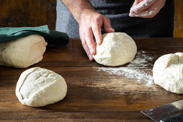 Man preparing dough for cooking homemade bread