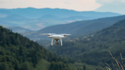 Flying drone in the mountains. Professional film equipment_4