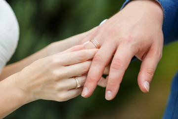 Newlyweds put each other rings on the ceremony