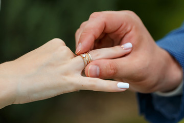 Newlyweds put each other rings on the ceremony