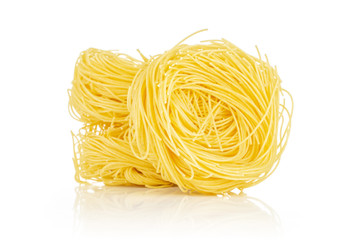 Group of three whole raw pasta angel hair isolated on white background
