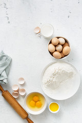 Fototapeta na wymiar Dough ingredients on a white background top view