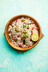 Dapde Pohe is a typical Maharashtrian breakfast, made with thin variety of poha and fresh coconut with chilli, peanuts and nuts. served in a bowl or plate. selective focus