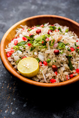 Dapde Pohe is a typical Maharashtrian breakfast, made with thin variety of poha and fresh coconut with chilli, peanuts and nuts. served in a bowl or plate. selective focus