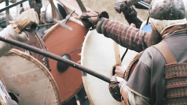 Knight warriors in battle. Medieval soldiers in full armor in melee combat