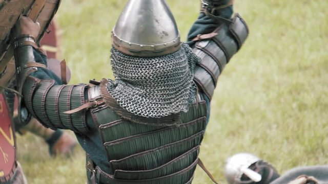 Knight warriors in battle. Medieval soldiers in full armor in melee combat