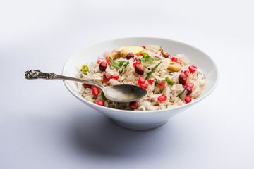 Dapde Pohe is a typical Maharashtrian breakfast, made with thin variety of poha and fresh coconut with chilli, peanuts and nuts. served in a bowl or plate. selective focus