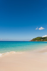 Fototapeta na wymiar Tropical beach with white sand turquoise water