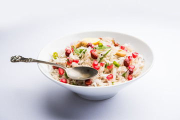 Dapde Pohe is a typical Maharashtrian breakfast, made with thin variety of poha and fresh coconut with chilli, peanuts and nuts. served in a bowl or plate. selective focus