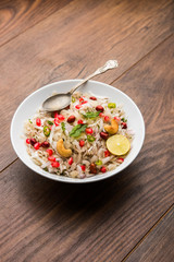 Dapde Pohe is a typical Maharashtrian breakfast, made with thin variety of poha and fresh coconut with chilli, peanuts and nuts. served in a bowl or plate. selective focus
