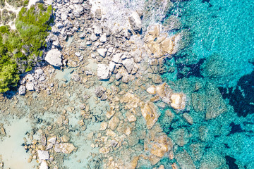 Aerial view of beautiful rocky coastline with turquoise sea water..