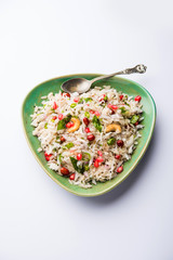 Dapde Pohe is a typical Maharashtrian breakfast, made with thin variety of poha and fresh coconut with chilli, peanuts and nuts. served in a bowl or plate. selective focus