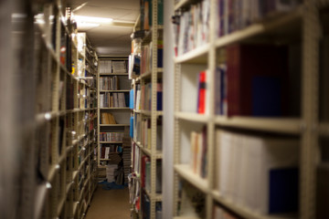 Blurred background. Library, books. Close-up.