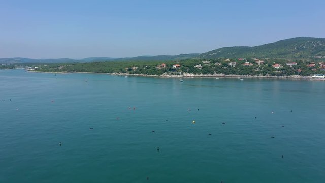 Sea shore near Trieste, Italy. Aerial drone view of ruines of the old fortress of Duino Castle.
