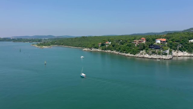 Sea shore near Trieste, Italy. Aerial drone view of ruines of the old fortress of Duino Castle.