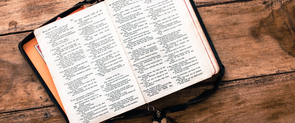 Holy Bible isolated on old vintage wooden table