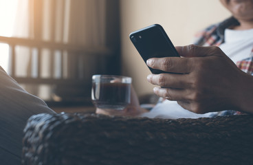 Man using smartphone at coffee shop
