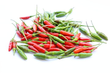 Group of green and red chillies on white background