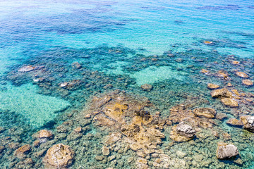 Naklejka na ściany i meble Aerial view of beautiful rocky coastline with turquoise sea water..