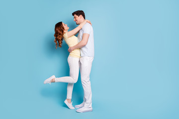 Full length body size profile side view of his he her she nice attractive lovely cheerful cheery glad spouses wearing casual isolated over bright vivid shine blue green background