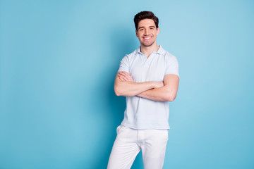 Portrait of his he nice attractive cheerful cheery glad cool guy folded arms isolated over bright vivid shine blue green background