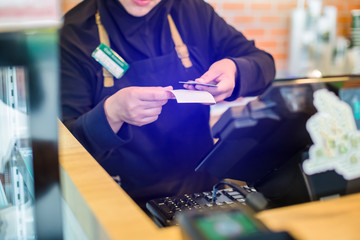 Cashier take banknote from consumer hand. Hand Paying Money To Worker In Coffee shop. Saleswoman receiving payment from male customer in store.