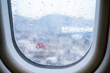 view of window airplane while rainy day