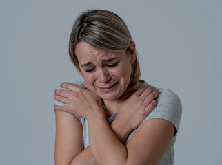 Fototapeta premium Portrait of depressed woman feeling desperate and in pain. Human expressions and emotions