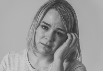 Portrait of sad and intimidated woman. Isolated in white background. Human expressions and emotions