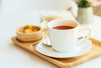 Hot tea on wooden tray