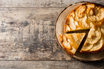 Homemade apple pie on wooden table. Top view. Copy space