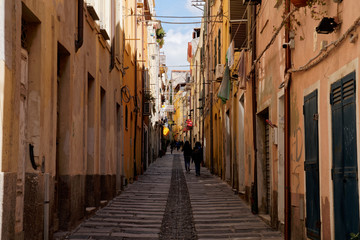 Fototapeta na wymiar Typical pedestrian street between two row of houses in Cagliari (Sardinia) Italy