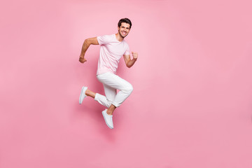Fototapeta na wymiar Full size profile side photo of content guy moving isolated over pink background