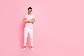 Full length body size view portrait of his he nice attractive handsome lovely virile muscular cheerful cheery content guy folded arms isolated over pink pastel background