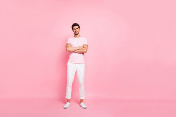 Full length body size view portrait of his he nice attractive lovely virile peaceful content guy standing folded arms isolated over pink pastel background