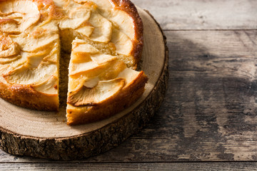 Homemade apple pie on wooden table. Copyspace