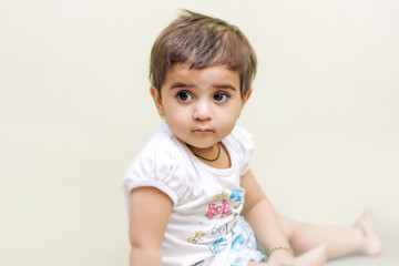 cute Indian baby girl playing at home