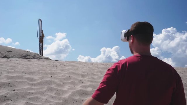 Architect uses VR glasses on the construction at the desert.