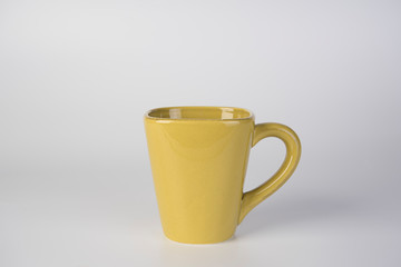 yellow cup isolated on white background