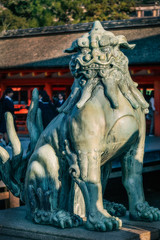 A Komainu Bronze Lion sculpture, the guarding creature protecting the entrance at Itsukushima...