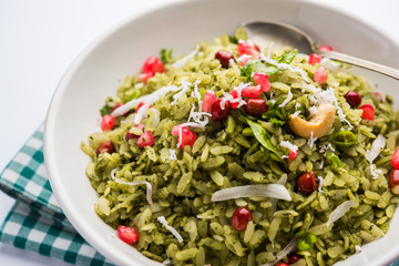 Hariyali Poha / Green Masala Pohe or flattened rice served in a bowl, selective focus