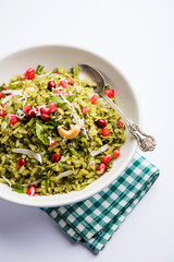 Hariyali Poha / Green Masala Pohe or flattened rice served in a bowl, selective focus