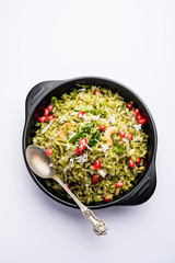 Hariyali Poha / Green Masala Pohe or flattened rice served in a bowl, selective focus