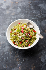 Hariyali Poha / Green Masala Pohe or flattened rice served in a bowl, selective focus