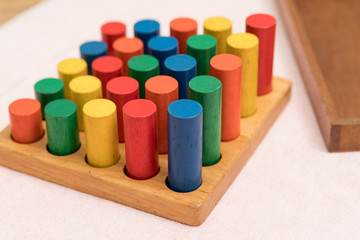 Top view closeup of colorful wooden Montessori sensorial material learning, Sizing and order block. Kindergarten educational toys, Thinking process, Cognitive skills, Learn Through Play tools concept.