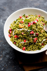 Hariyali Poha / Green Masala Pohe or flattened rice served in a bowl, selective focus