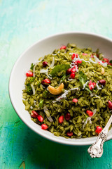 Hariyali Poha / Green Masala Pohe or flattened rice served in a bowl, selective focus