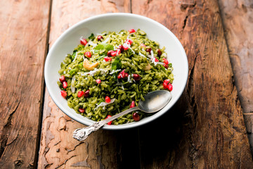 Hariyali Poha / Green Masala Pohe or flattened rice served in a bowl, selective focus